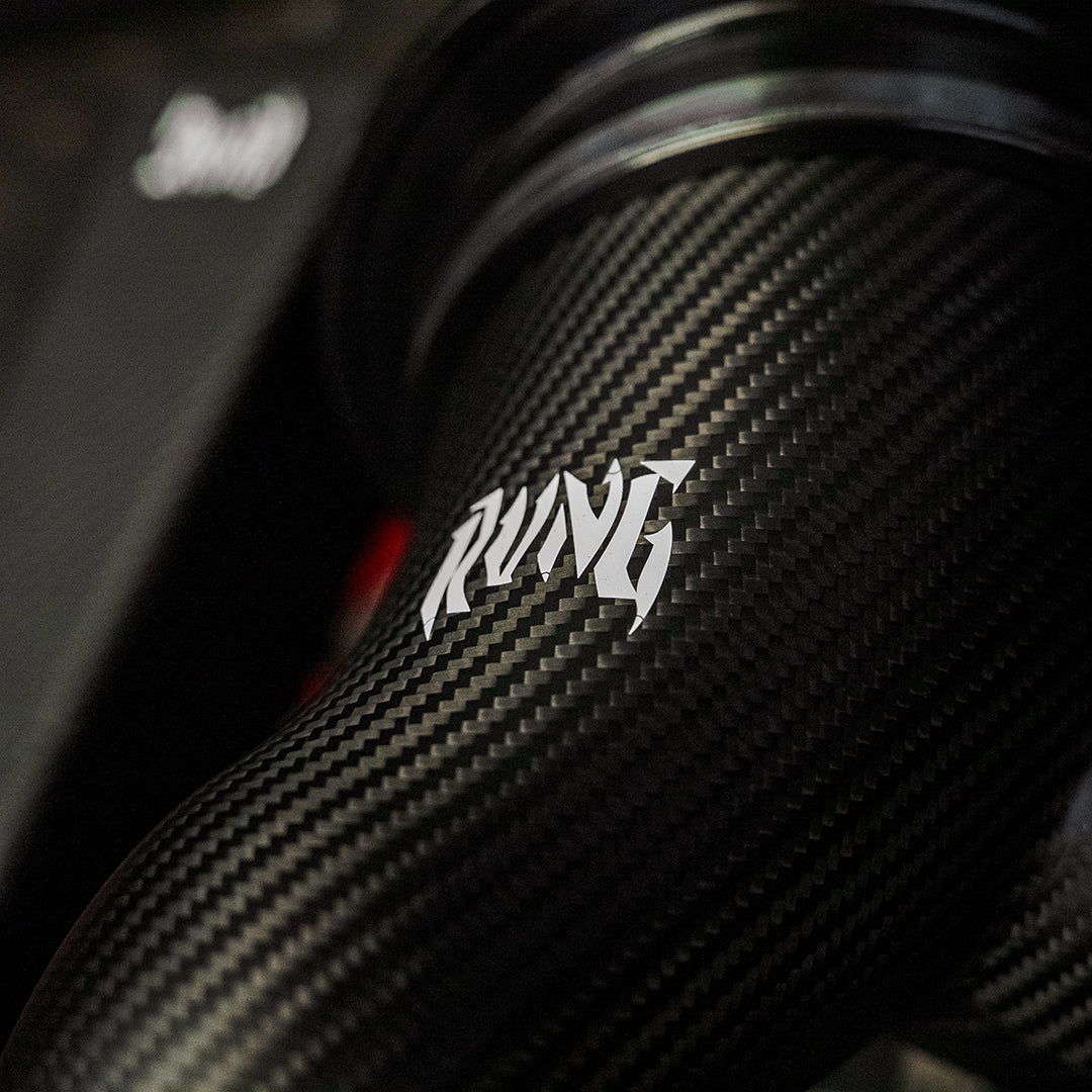 Close-up of the RVNG logo on the MonoFlow carbon fiber intake pipe