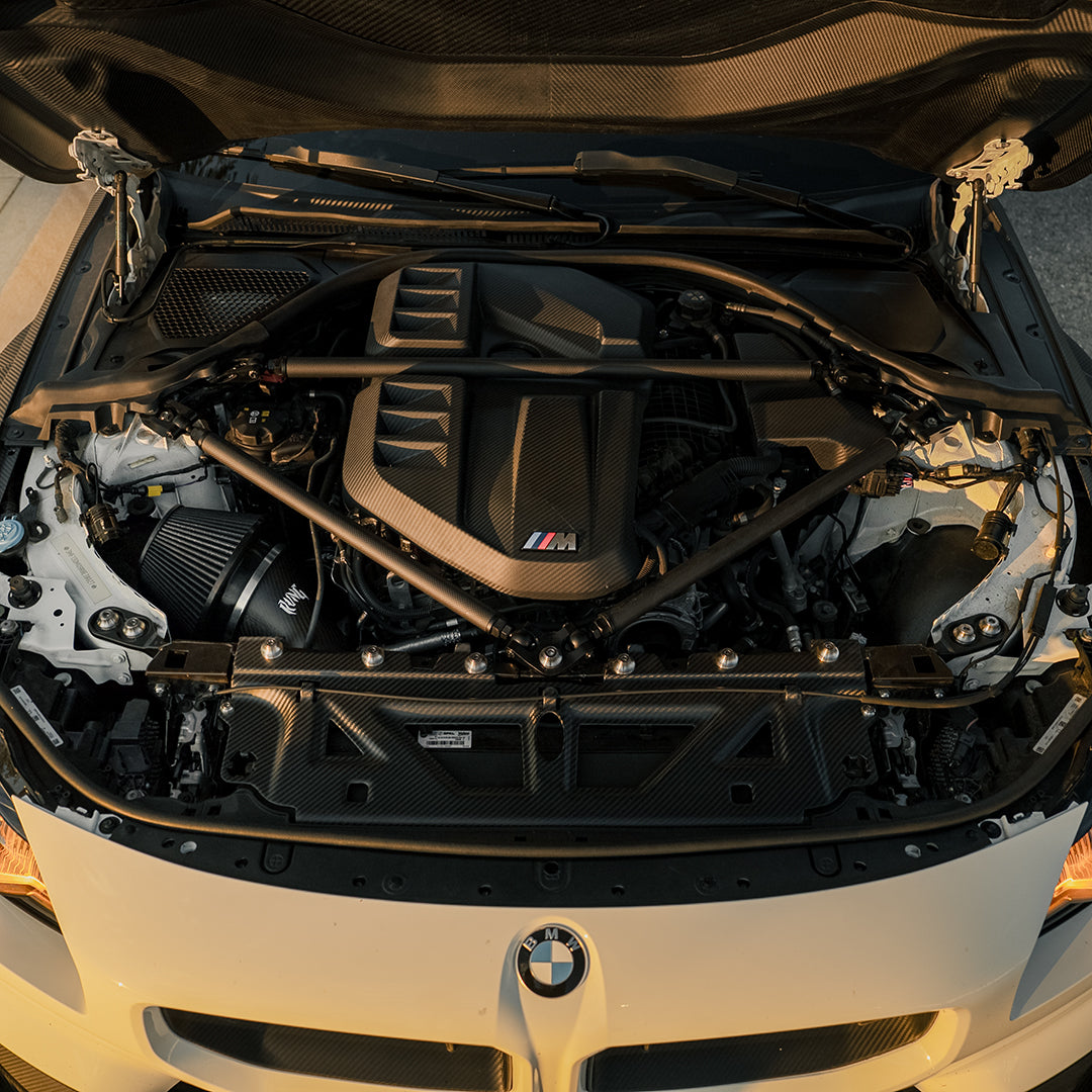 RVNG MonoFlow intake installed in a white BMW G8X S58 engine bay