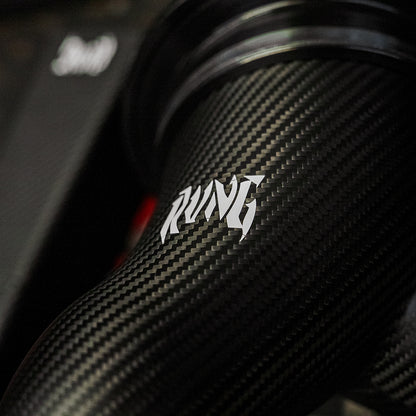 Close-up of the RVNG logo on the MonoFlow carbon fiber intake pipe