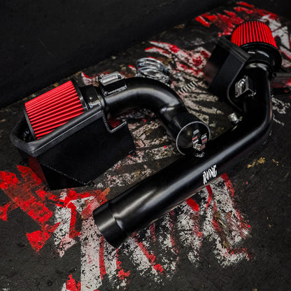 Close-up of the RVNG F8X S55 intake heat shield box and red cone filter