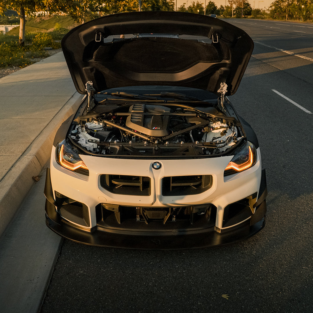 White BMW G87 M2 with the RVNG MonoFlow intake, hood open